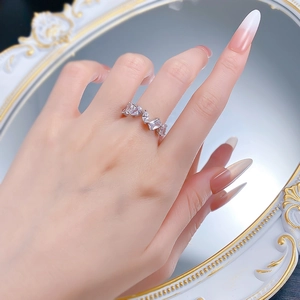 Detail of S925 silver ring featuring marquise and teardrop cut cubic zirconia accents
