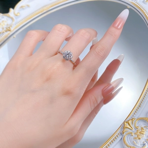 Detailed view of an S925 silver flower-shaped halo ring with round central gemstone
