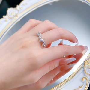 Close-up of S925 silver ring featuring irregular mixed-cut zirconia on a model finger