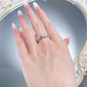 Detail of S925 sterling silver ring with irregular marquise and rectangular zirconia