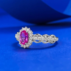 Elegant S925 silver ring featuring an oval pink sapphire and pavé diamond halo
