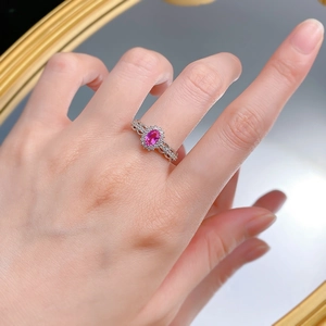 Detailed view of an S925 silver ring featuring a pink oval stone and vintage hollow band