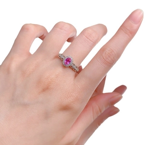 Elegant S925 silver ring with oval pink sapphire and twisted hollow band on model hand