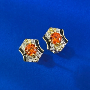 925 silver gold-plated hexagonal earrings with orange stone and blue background