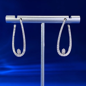 Detailed close-up of S925 silver long drop earrings with marquise-cut stones on a stand