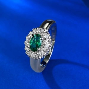 Luxurious S925 silver ring featuring an oval emerald-style gemstone with zircon halo