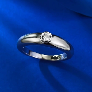 Minimalist S925 silver ring featuring a round bezel-set white diamond on blue silk