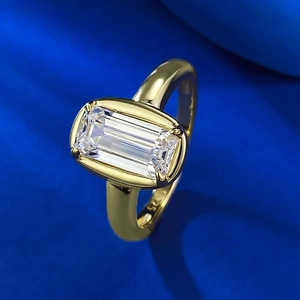 S925 silver emerald cut rectangular ring with 18k gold plating on blue background