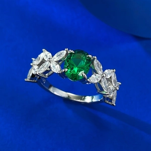 Elegant S925 sterling silver ring with oval emerald zircon and marquise leaf accents