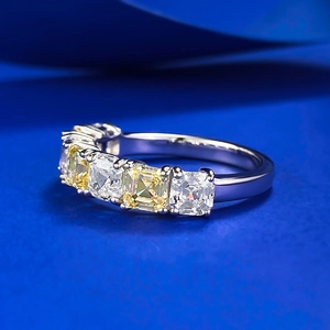 Macro shot of S925 silver ring featuring alternating yellow and white baguette diamonds
