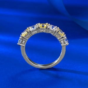 S925 silver ring with yellow and white square-cut stones on deep blue silk background