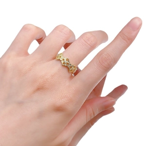 Elegant 925 silver gold plated hollow floral pattern ring with zircon accents on hand