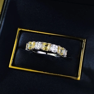Macro detail of S925 silver ring featuring alternating yellow and clear square-cut diamonds