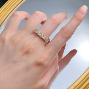 S925 silver eternity ring with emerald-cut yellow and white high carbon diamonds on a hand