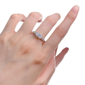 Elegant S925 silver ring with a 2-carat oval gemstone and pave diamond band on finger
