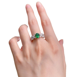 Elegant S925 silver ring featuring an oval green emerald zircon with marquise accents