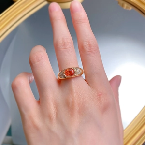 Retro S925 silver gold plated ring with orange oval diamond and pavé accents on finger