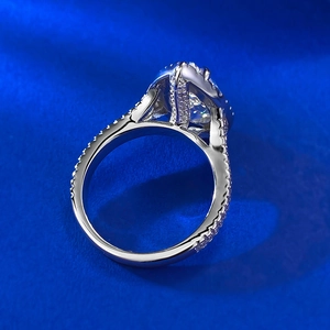 Macro side view of S925 silver halo ring featuring a pear-shaped water drop gemstone