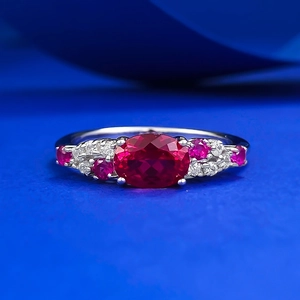 Luxurious S925 silver ring with an oval pigeon blood red gemstone and pavé accents