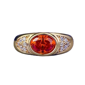 S925 silver gold-plated ring with large oval orange gemstone and white accent stones