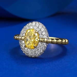 Luxurious gold plated S925 silver ring with large oval yellow carbon diamond and halo setting