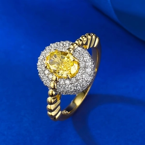 Elegant gold plated S925 silver ring featuring a yellow cushion cut stone in a halo setting