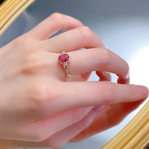 Macro shot of S925 silver ring with oval pigeon blood ruby and rose gold plating
