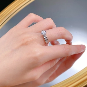 Macro shot of 6mm round cubic zirconia ring in classic six-prong silver setting