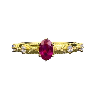 Vintage S925 gilded ring with oval pigeon blood red stone and detailed bead texture