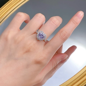 Detail of 925 silver ring with 8x8mm heart-shaped lavender gem and pavé diamond halo