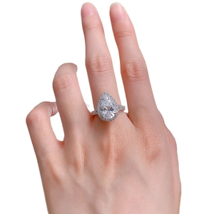 S925 silver pear cut halo diamond ring with split shank on a model hand