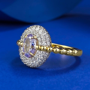 S925 gilded ring featuring an oval purple stone and sparkling ice-cut carbon diamonds
