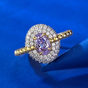 Luxurious S925 gilded ring featuring an oval purple stone and halo of white zircons