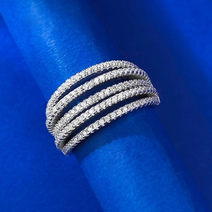Macro view of a five-row micro-pave diamond eternity ring in silver setting
