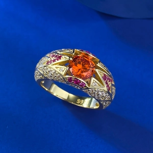 Macro detail of S925 silver ring featuring orange center stone and luxury pavé setting