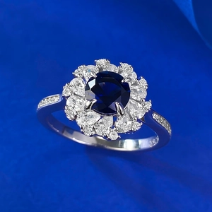 Macro shot of S925 sterling silver stamp on a blue sapphire flower cluster ring band