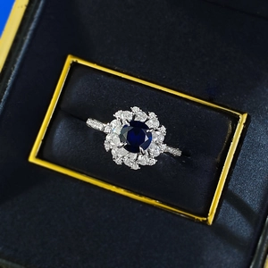 Elegant S925 silver ring with 6mm blue corundum center stone and sparkling cluster halo