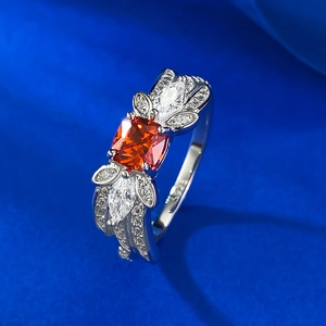Macro view of S925 sterling silver ring with orange gemstone and cubic zirconia