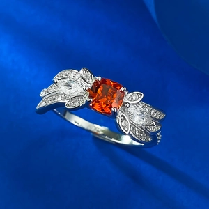 S925 silver butterfly ring with vibrant 1-carat square orange gemstone on blue silk