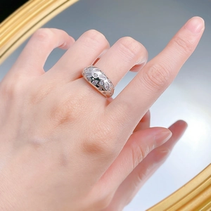 Macro shot of S925 silver wide ring featuring multi-cut stones and pink crystals