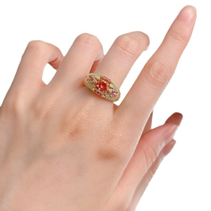 Luxurious S925 silver ring with 1ct round orange stone and red gem accents on hand