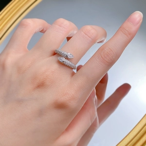 Close-up of S925 silver snake ring with pavé diamonds and pear-cut stones on finger