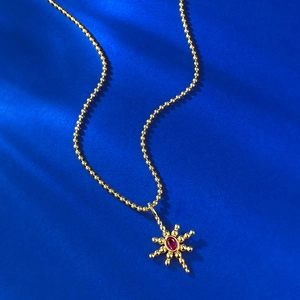 S925 silver gold-plated North Star necklace with red gemstone pendant on blue background