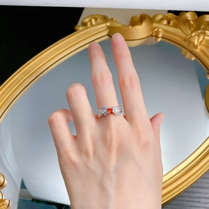Detail of S925 silver ring with 5x5mm square orange gemstone and pave zircon wings