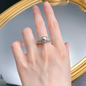 Detail view of 8mm gray pearl ring with pavé diamonds and intricate side metalwork