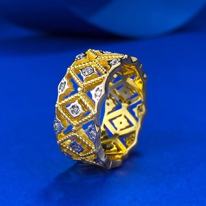 Lace hollow geometric gold-plated silver ring with shimmering diamonds on blue background