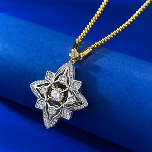 Close-up of starburst clover necklace with bicolor plating and sparkling zircons