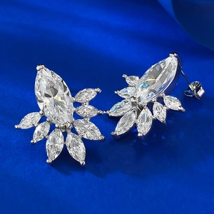 Macro view of S925 sterling silver stamp and marquise-cut crystal floral stud earrings