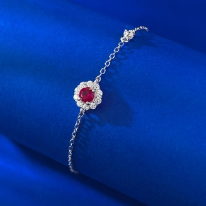 Elegant S925 silver bracelet featuring a pigeon blood red gemstone in flower design