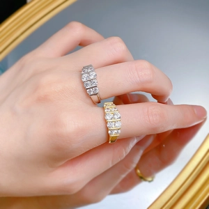 Detail shot of gold and silver S925 sterling silver rings with five row-set zircons